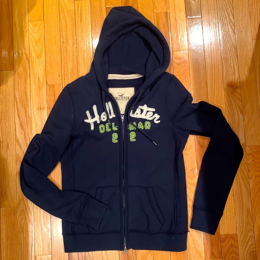 Hollister Women’s Large dark blue zip up hoodie with pockets
